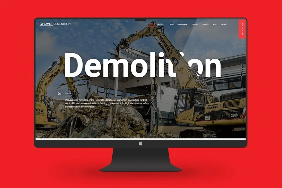 Home page banner design for the Weaver Demolition website displayed on a desktop computer